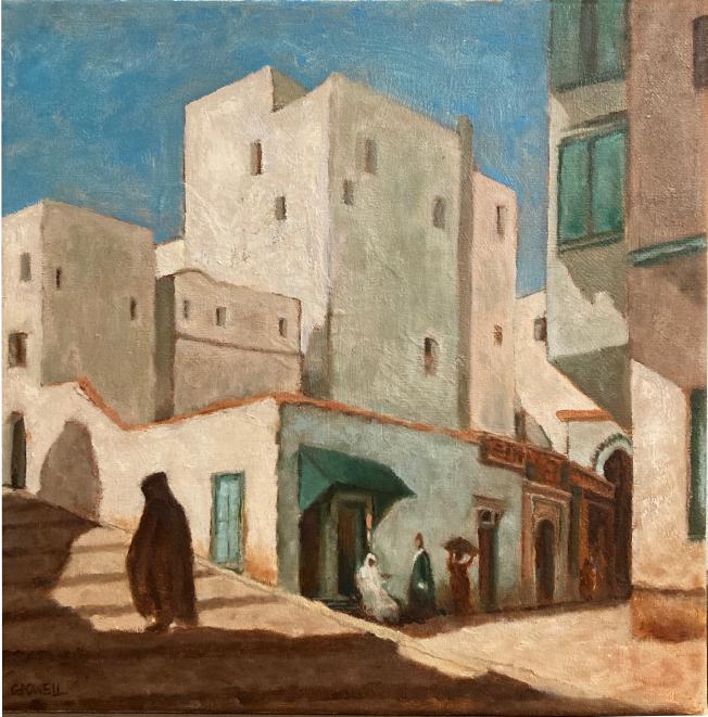 A cloaked man ascends a steep road in the warm afternoon light in front of Moroccan buildings bathed in light. A small group of figures look on from a short distance, relaxing in the shade. The color scheme is warm, with beige, brown, blue-greens and light blue.